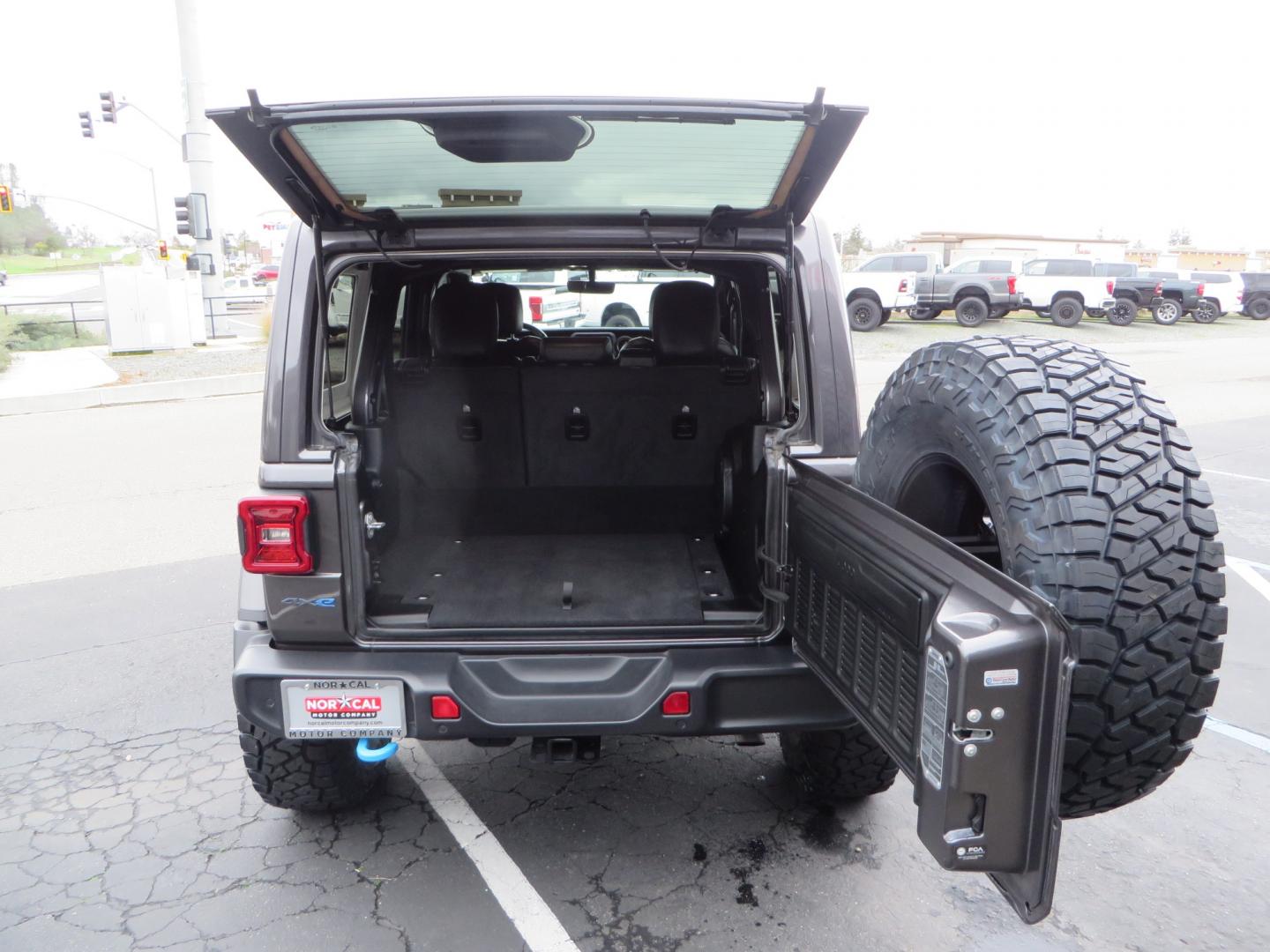 2021 CHARCOAL /BLACK Jeep Wrangler Unlimited Rubicon 4XE 4d SUV 4wd (1C4JJXR60MW) with an 2.0L L4 DOHC 16V TURBO engine, automatic transmission, located at 2630 Grass Valley Highway, Auburn, CA, 95603, (530) 508-5100, 38.937893, -121.095482 - 4XE Rubicon sitting on a Zone offroad suspension system, Fox shocks, 37" Toyo RT trail tires, 17" Method Race wheels, Teraflex Hd tire carrier, and Flat tow ready. - Photo#59